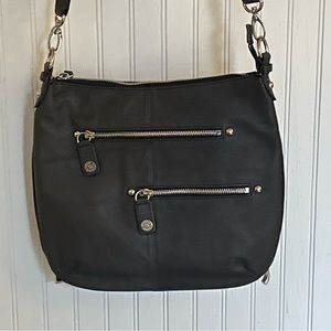 Black leather purse with concealed carry compartment for handgun.  Never used.